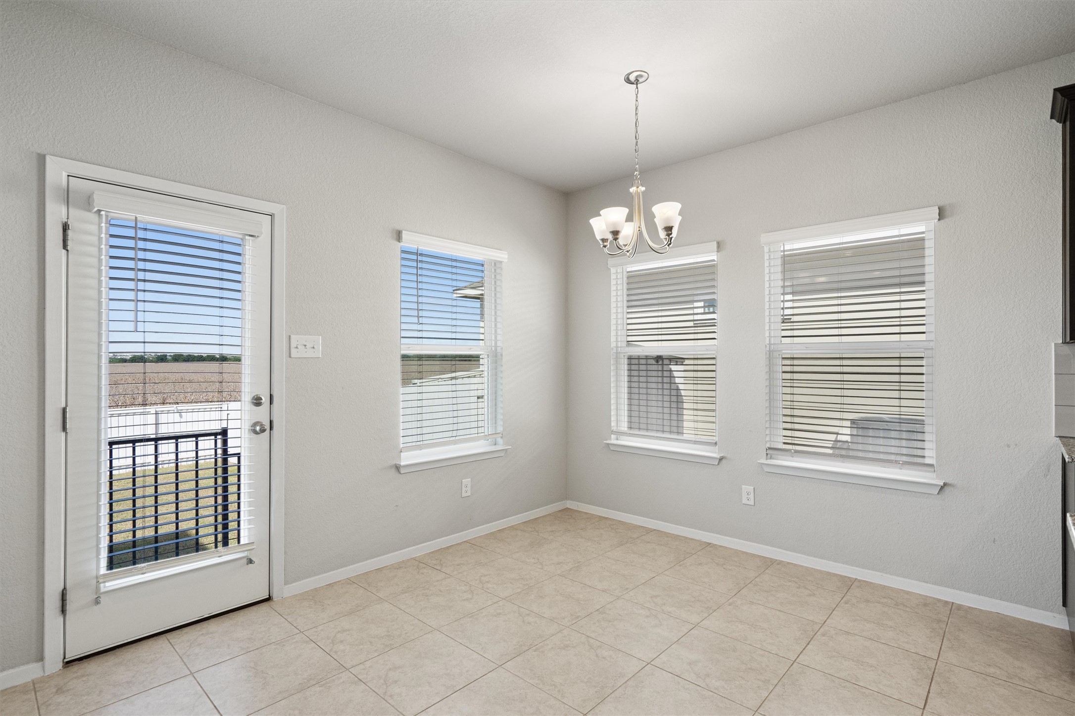 2711 Winding Creek Road Kyle, TX 78640 - Photo 10 of 33 a view of an empty room with a window