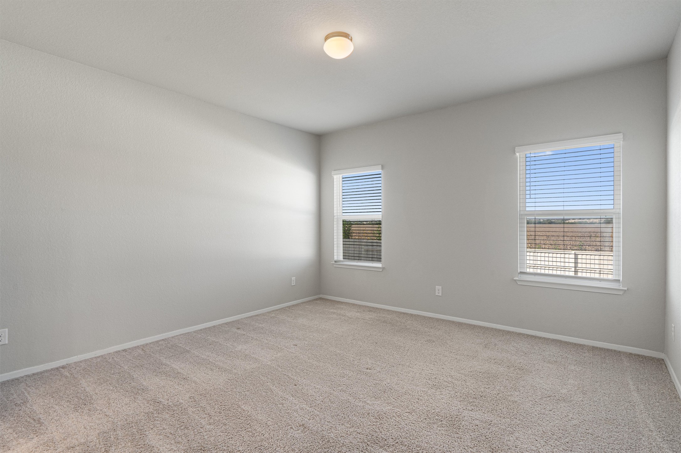 2711 Winding Creek Road Kyle, TX 78640 - Photo 14 of 34 an empty room with a window