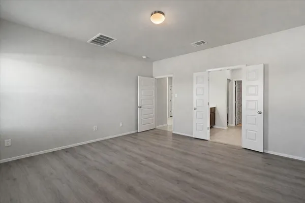 a kitchen with granite countertop cabinets stainless steel appliances and wooden cabinets