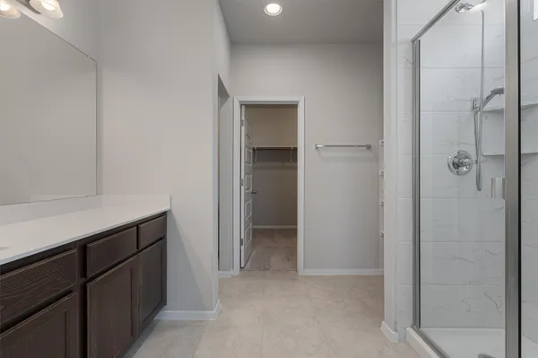 a bathroom with a sink double vanity and a mirror