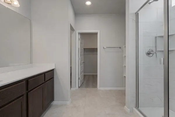 a bathroom with a sink double vanity and a mirror