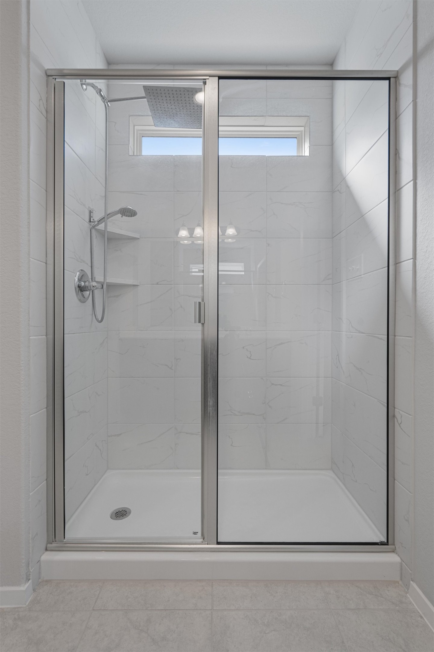 2711 Winding Creek Road Kyle, TX 78640 - Photo 19 of 33 a bathroom with a shower