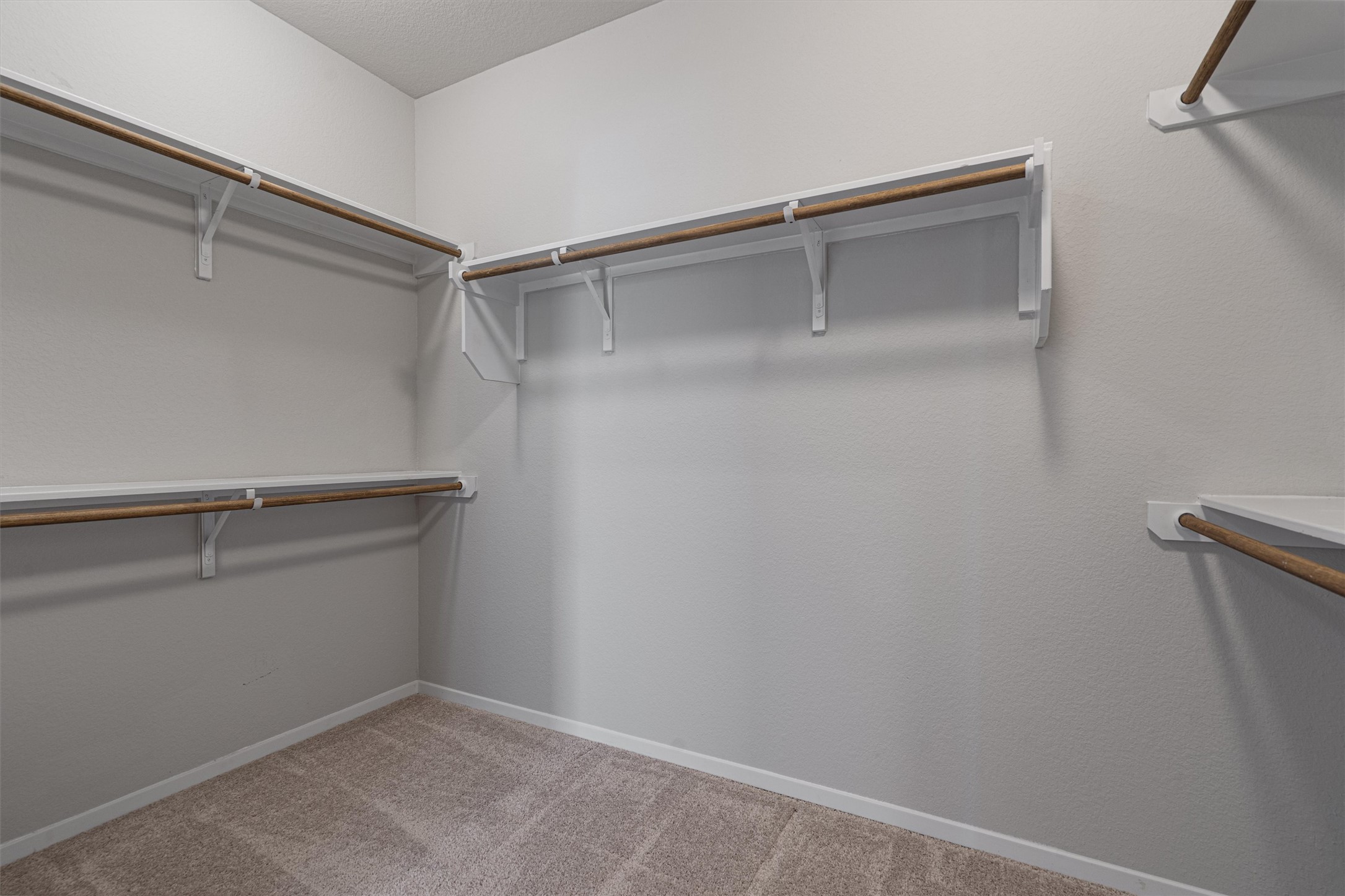 2711 Winding Creek Road Kyle, TX 78640 - Photo 19 of 34 a view of an empty walk in closet