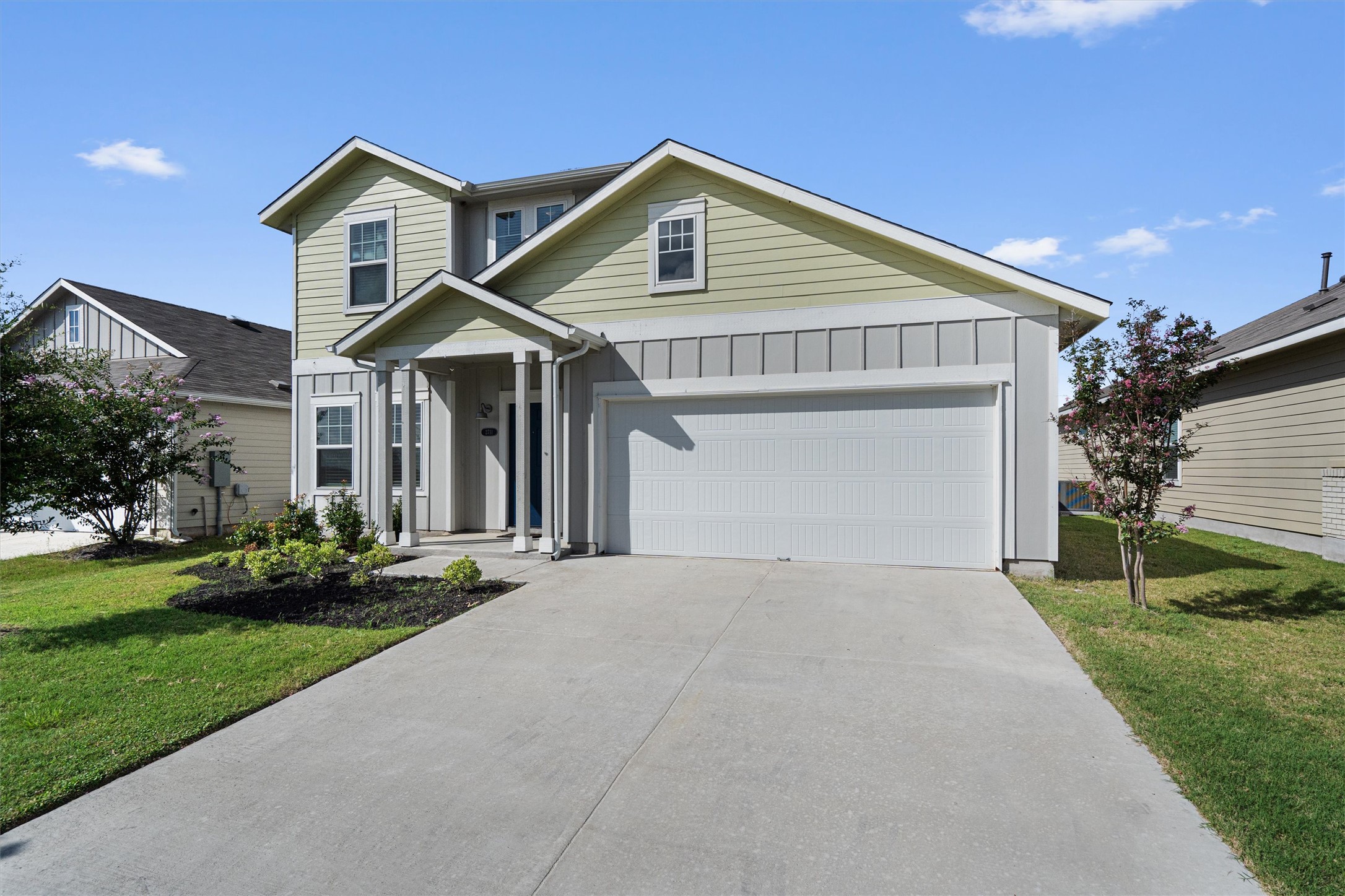 2711 Winding Creek Road Kyle, TX 78640 - Photo 2 of 34 a front view of a house with a yard