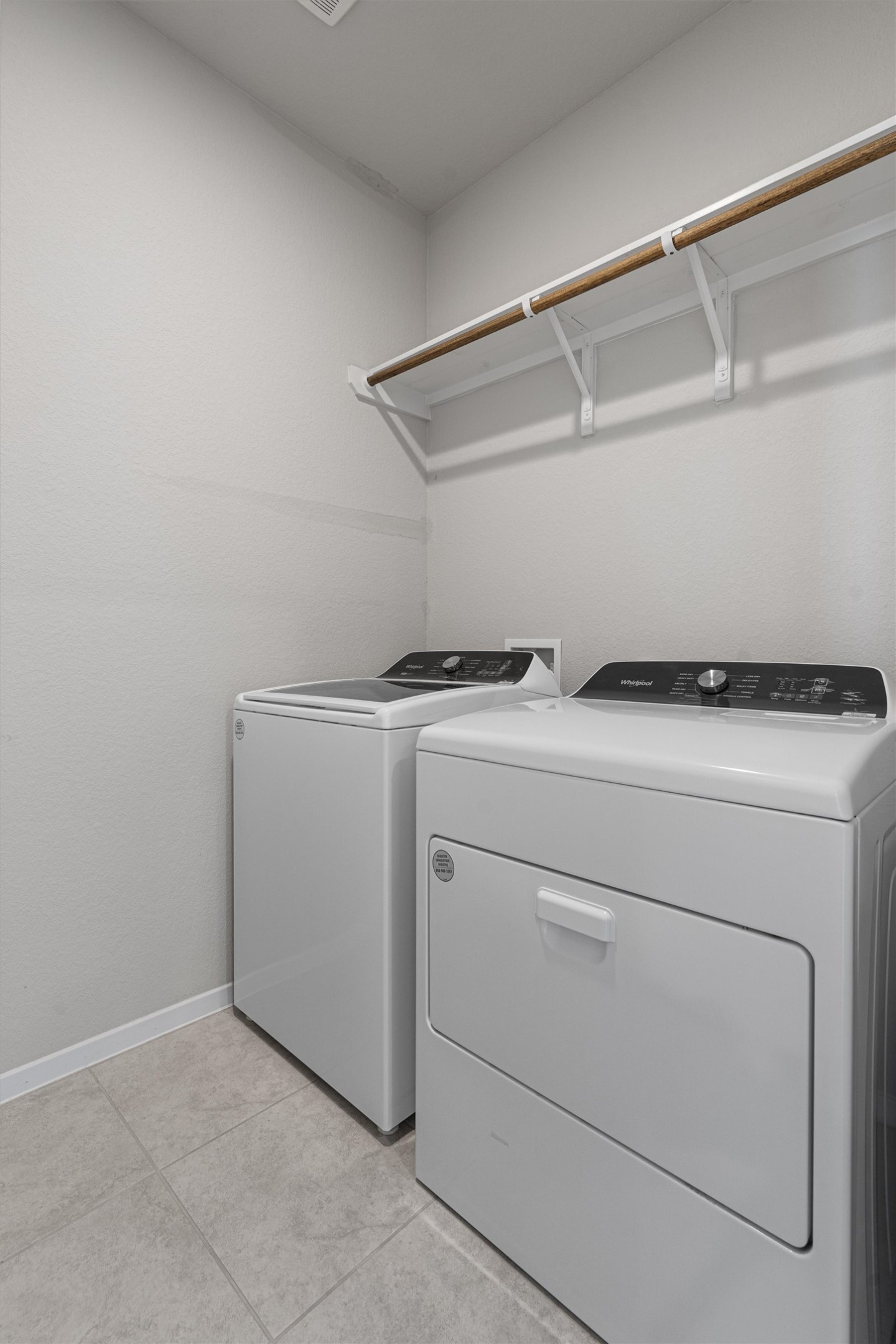 2711 Winding Creek Road Kyle, TX 78640 - Photo 21 of 33 a utility room with dryer and washer
