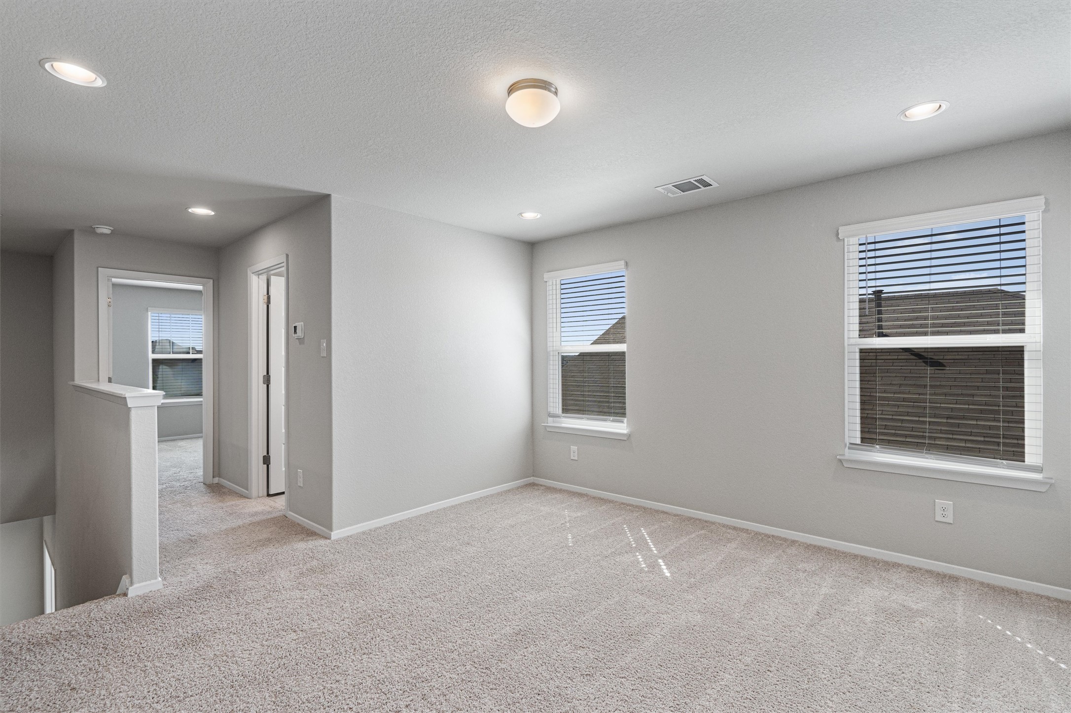 2711 Winding Creek Road Kyle, TX 78640 - Photo 24 of 34 a view of an empty room with a window