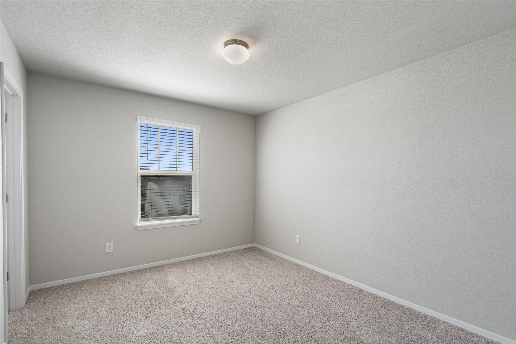 2711 Winding Creek Road Kyle, TX 78640 - Photo 25 of 34 an empty room with a window