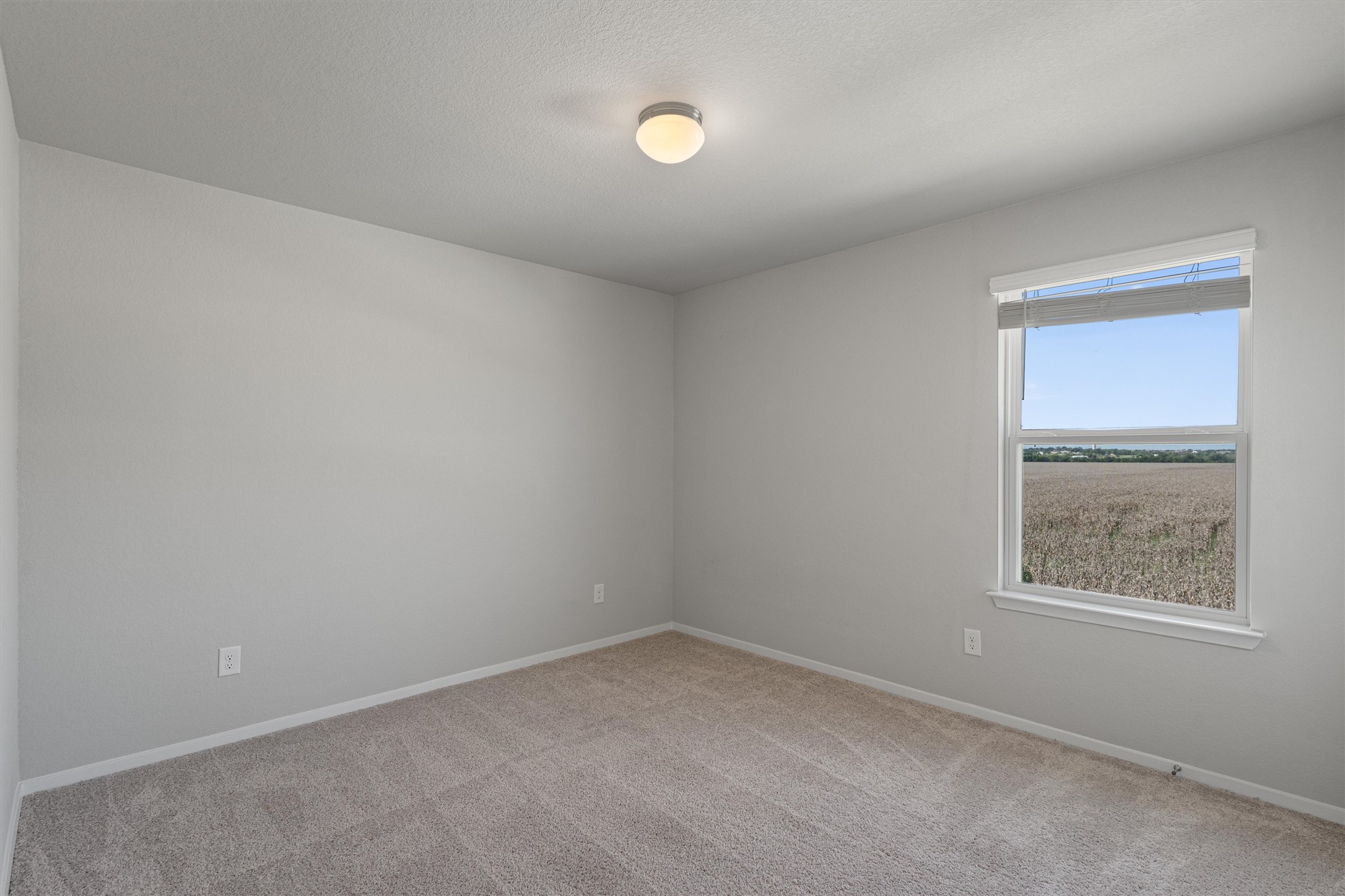 2711 Winding Creek Road Kyle, TX 78640 - Photo 30 of 34 an empty room with a window