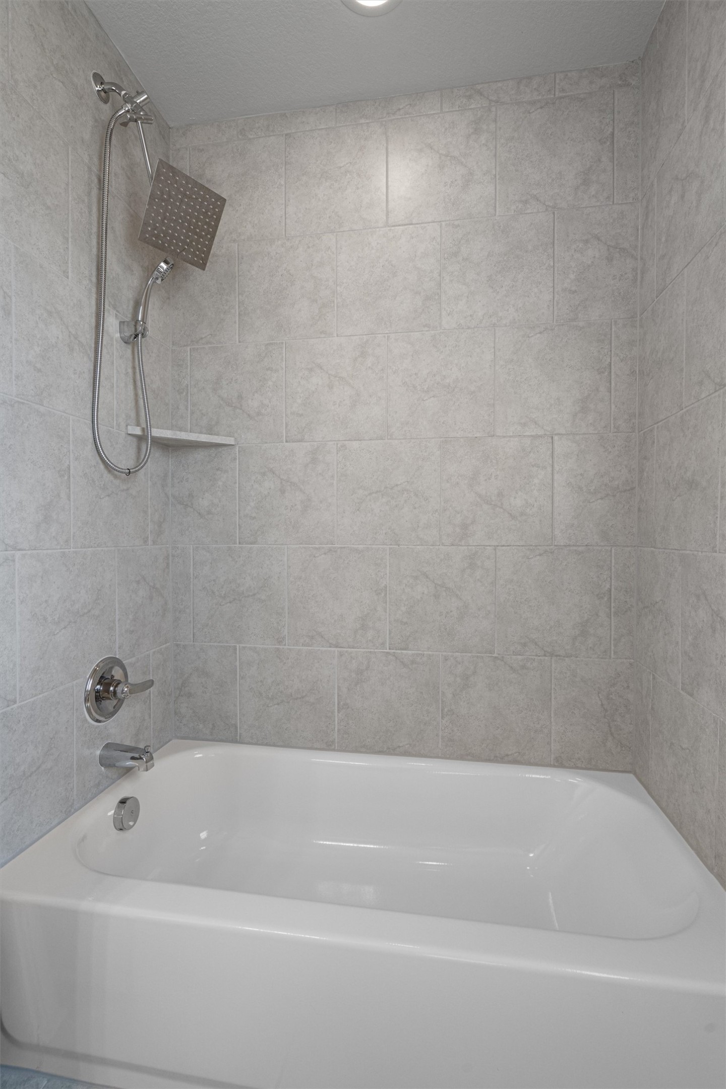 2711 Winding Creek Road Kyle, TX 78640 - Photo 30 of 33 a bathroom with a bath tub and a shower