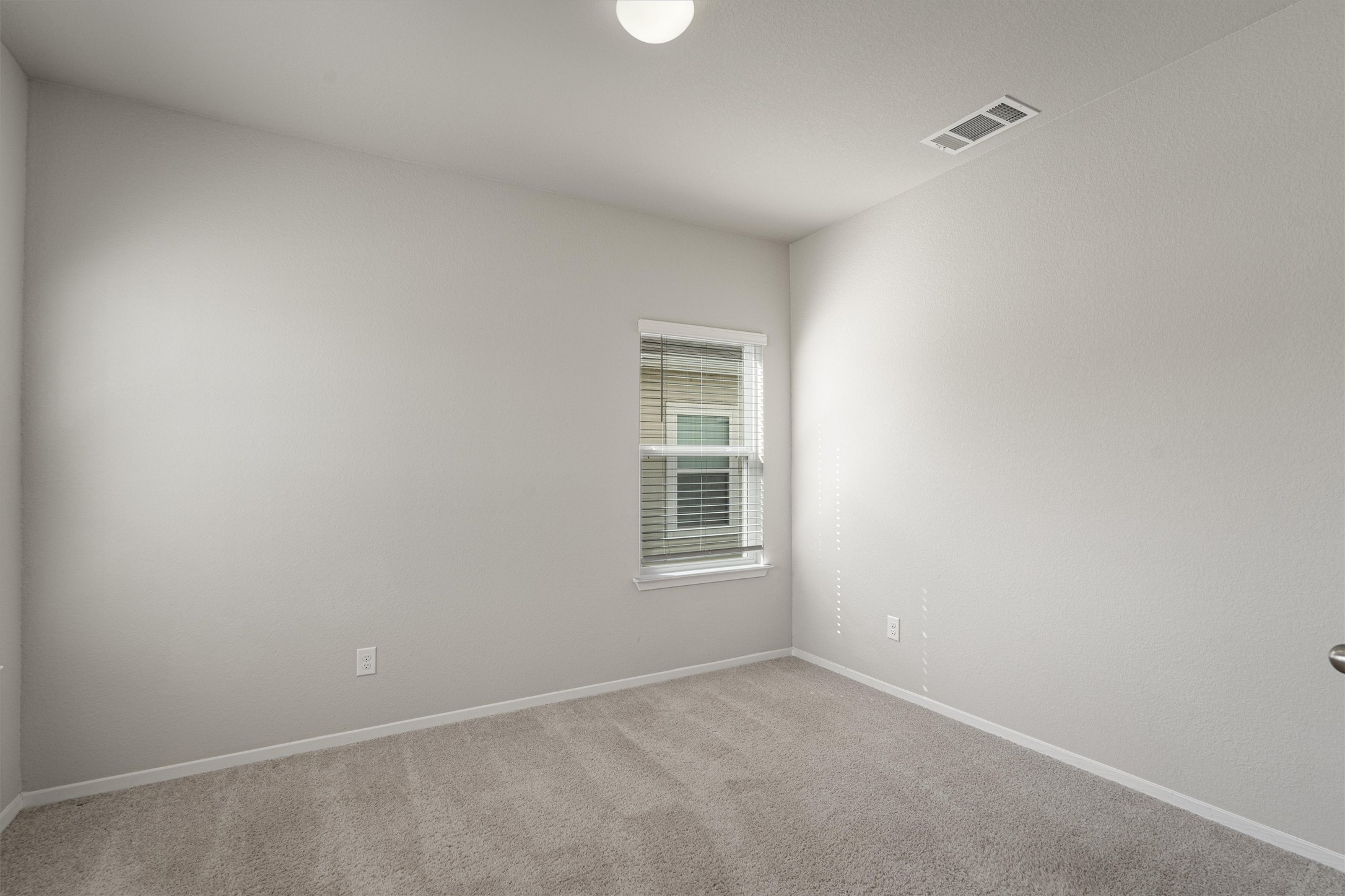 2711 Winding Creek Road Kyle, TX 78640 - Photo 4 of 34 a view of an empty room with a window