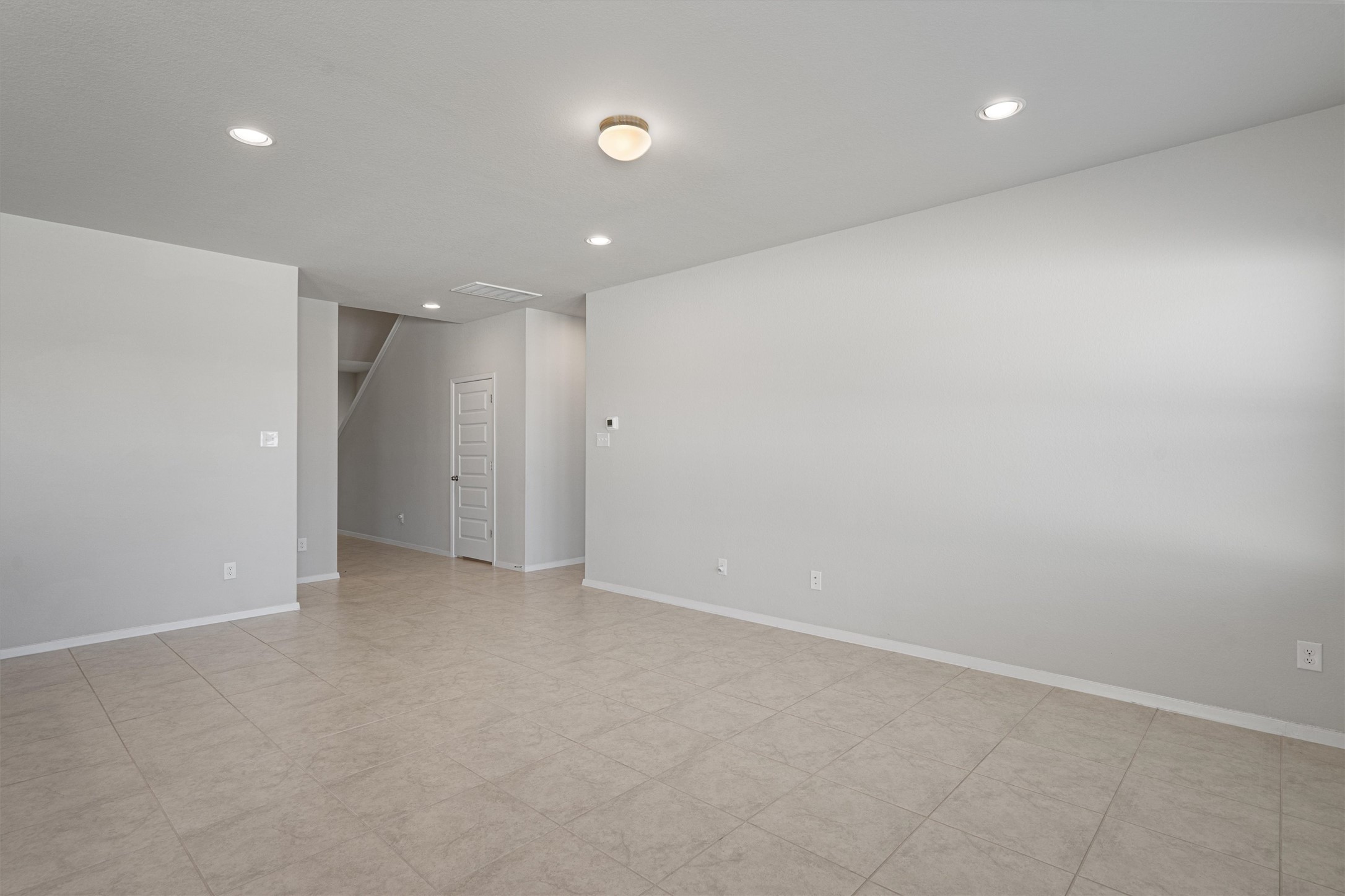2711 Winding Creek Road Kyle, TX 78640 - Photo 8 of 34 an empty room with an entryway