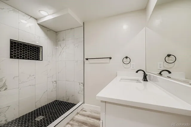 a bathroom with a sink and a mirror