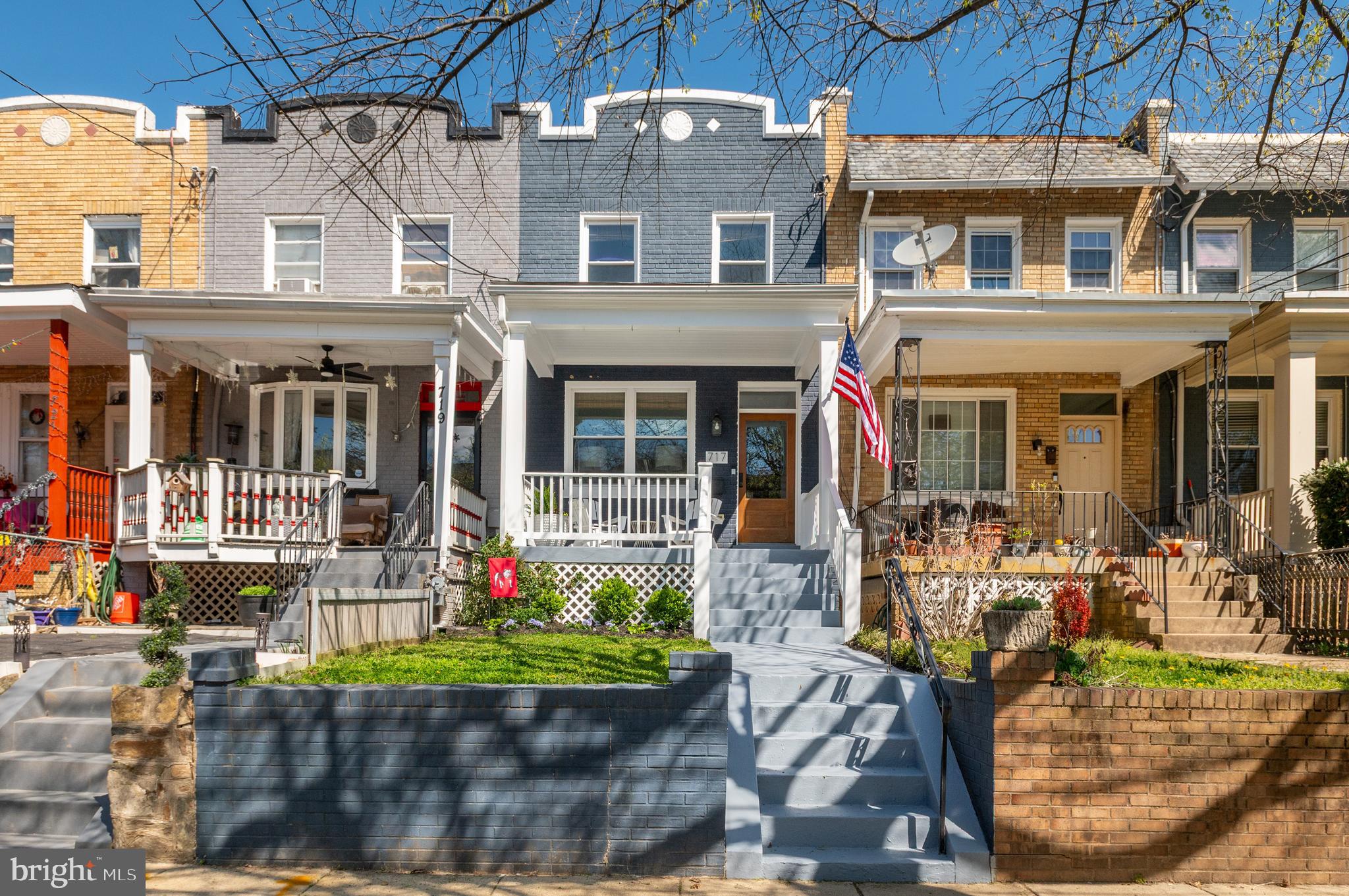 front view of a building with a garden