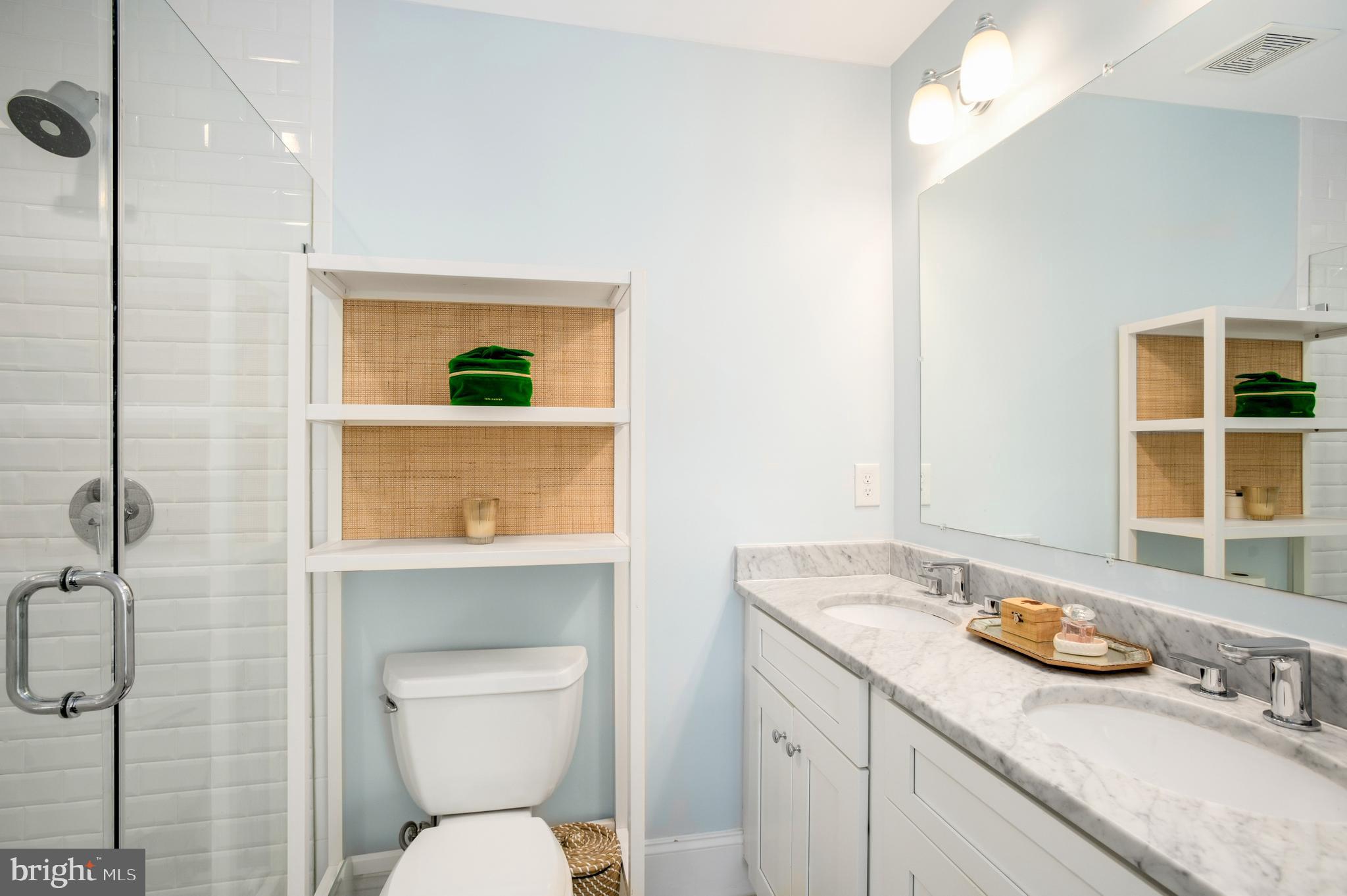 717 Hamilton Street Northwest Washington, DC 20011 - Photo 13 of 27 a bathroom with a granite countertop sink mirror vanity and toilet
