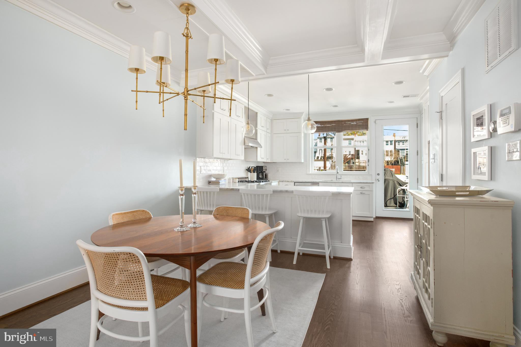 717 Hamilton Street Northwest Washington, DC 20011 - Photo 5 of 27 a dining room with stainless steel appliances kitchen island granite countertop a dining table chairs and view living room