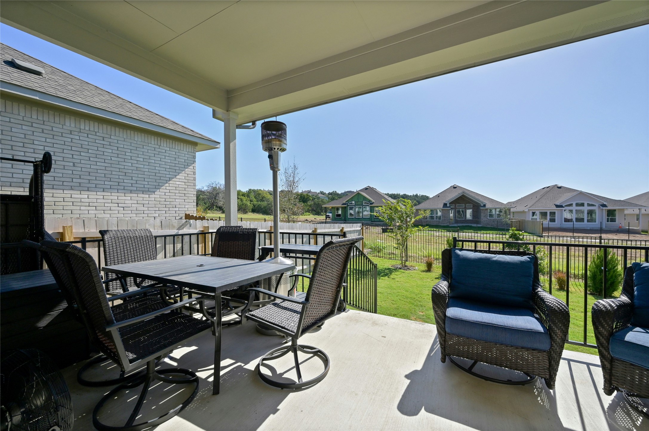 916 Leaning Oak Lane Georgetown, TX 78628 - Photo 25 of 32 View of patio with outdoor dining space and a residential view