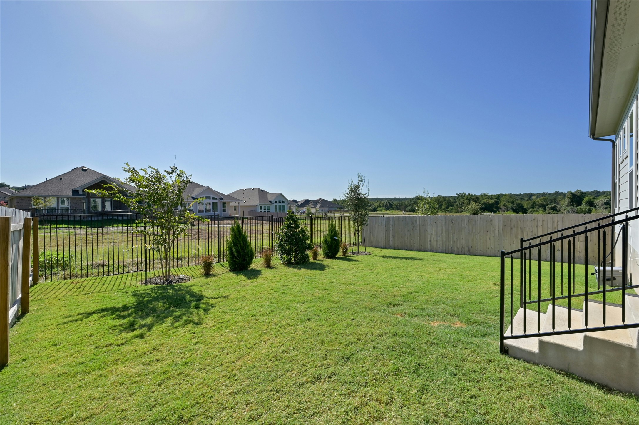 916 Leaning Oak Lane Georgetown, TX 78628 - Photo 27 of 32 Fenced backyard featuring a residential view