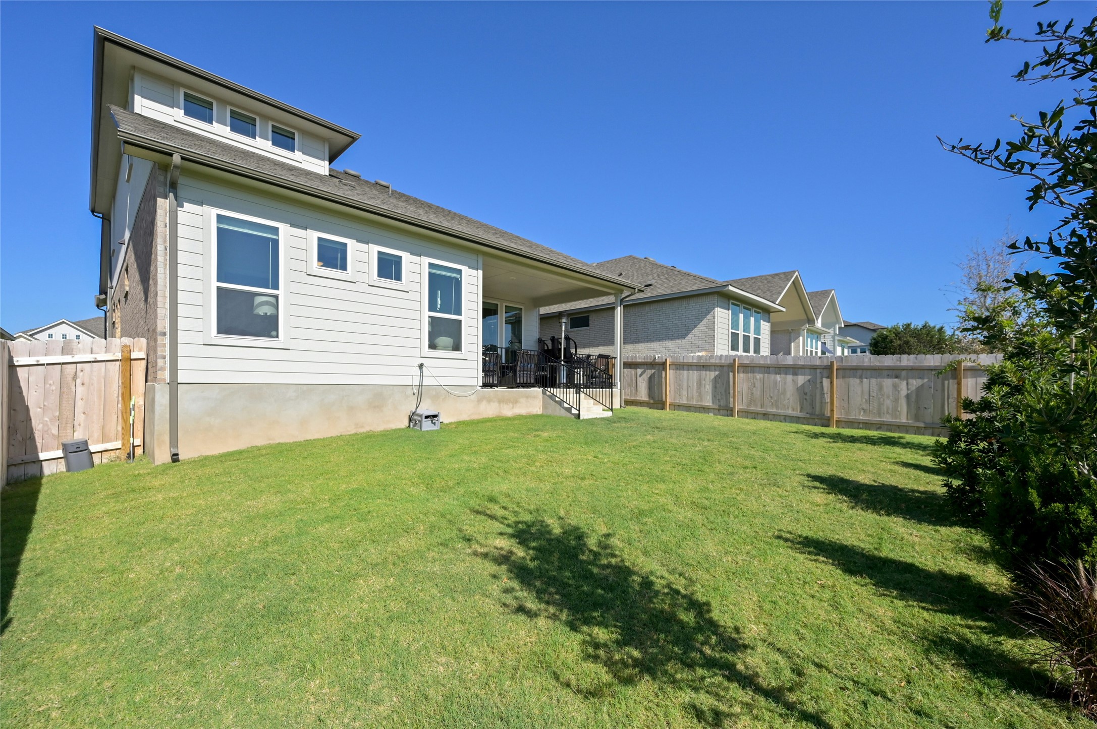 916 Leaning Oak Lane Georgetown, TX 78628 - Photo 28 of 32 Rear view of house featuring a patio and a fenced backyard