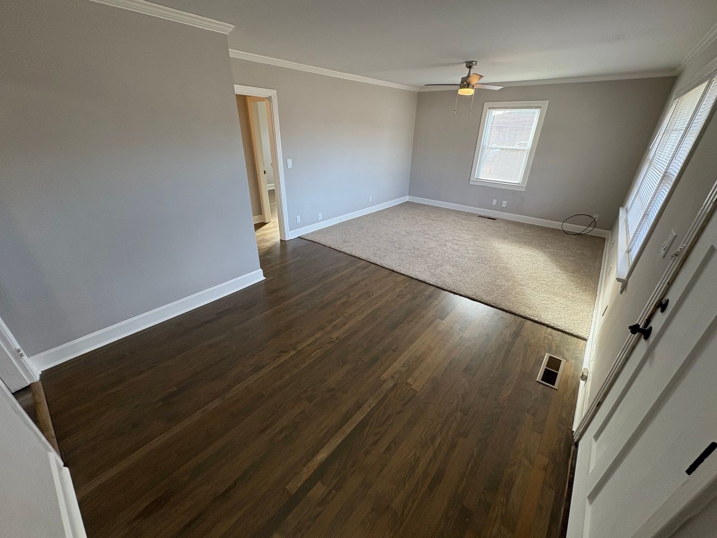 397 Franklin Road Lebanon, TN 37087 - Photo 4 of 8 an empty room with wooden floor and windows