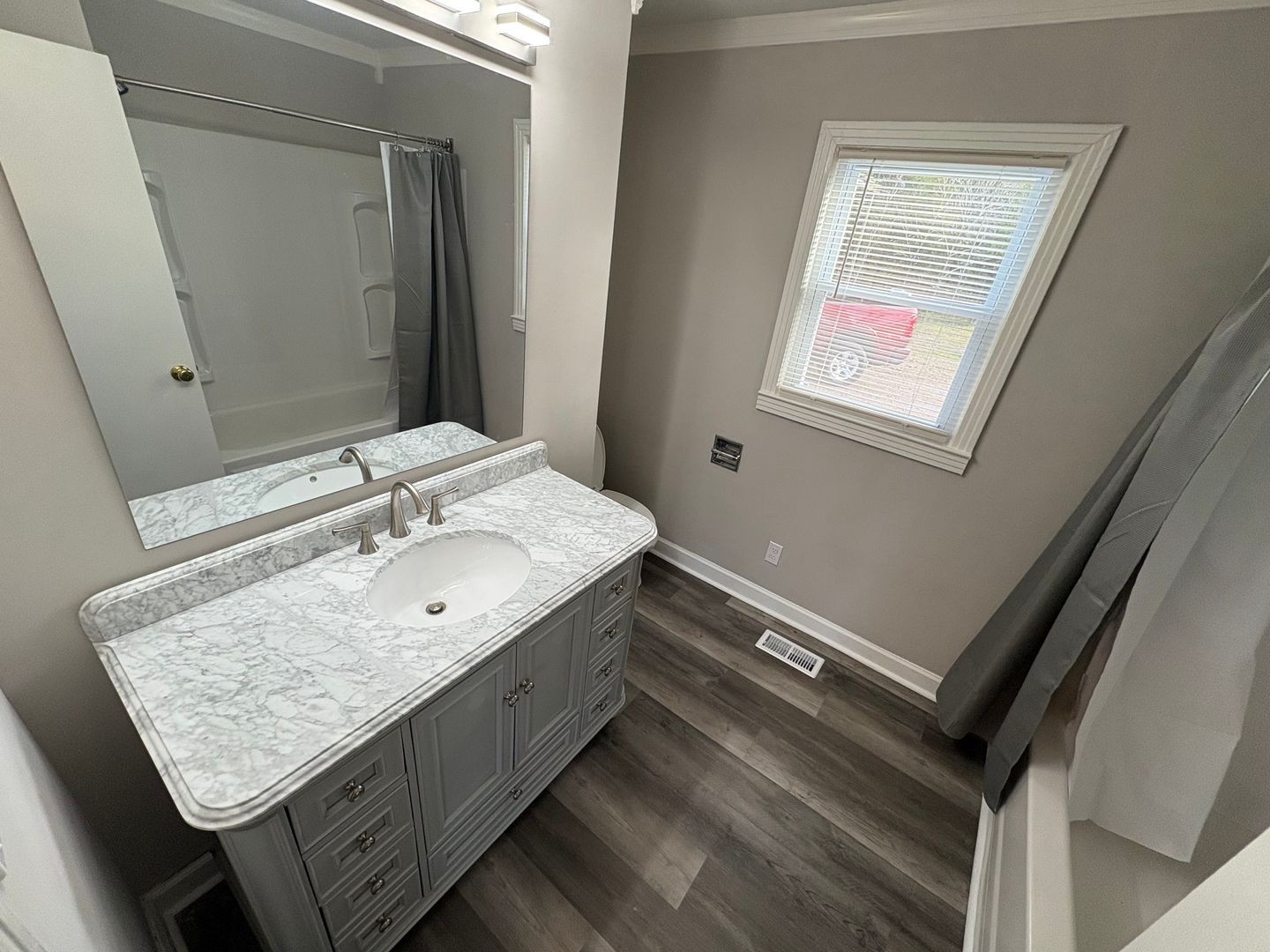 397 Franklin Road Lebanon, TN 37087 - Photo 6 of 8 a bathroom with a granite countertop sink and a mirror