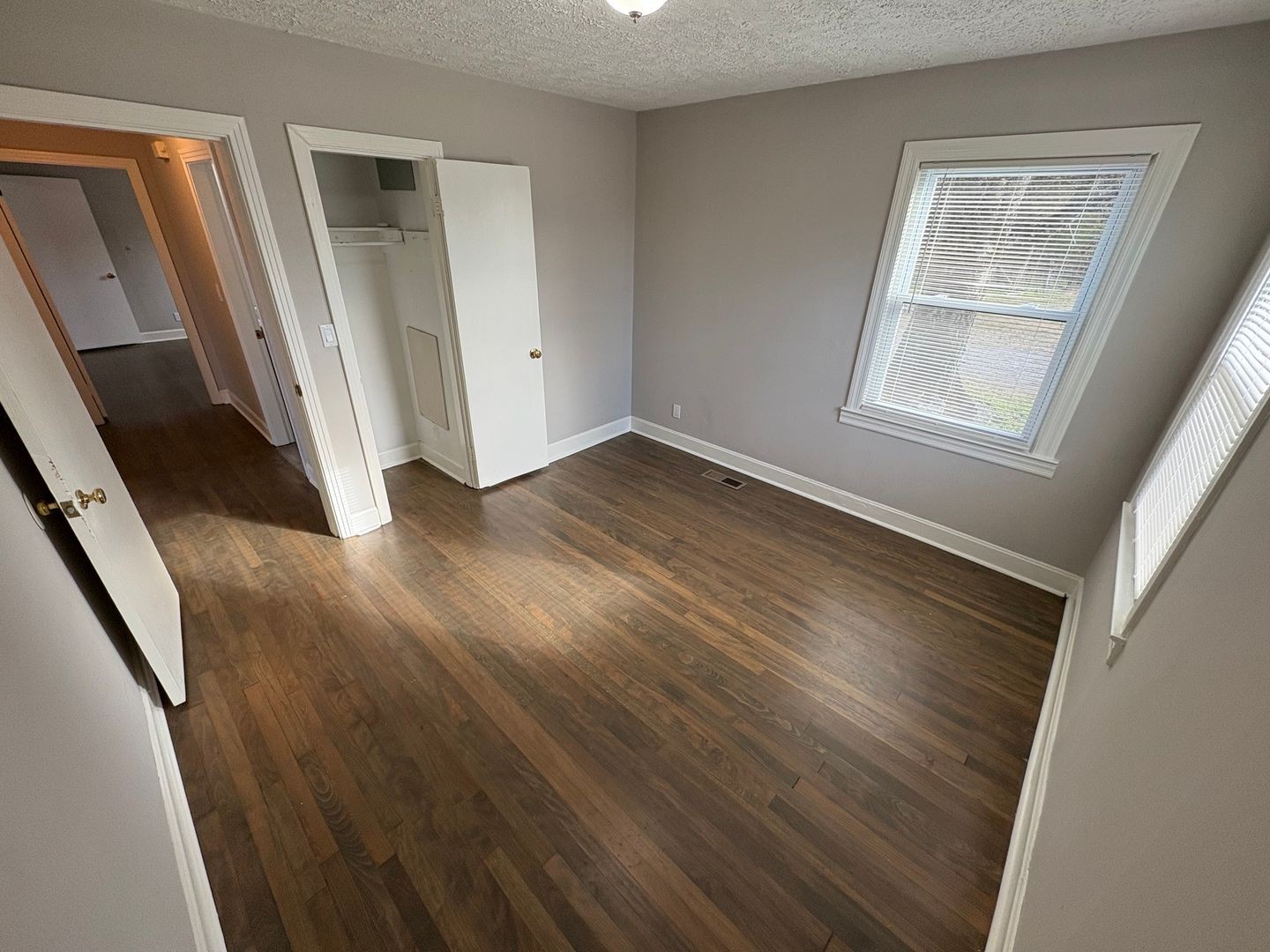 397 Franklin Road Lebanon, TN 37087 - Photo 7 of 8 a view of an empty room with wooden floor and a window