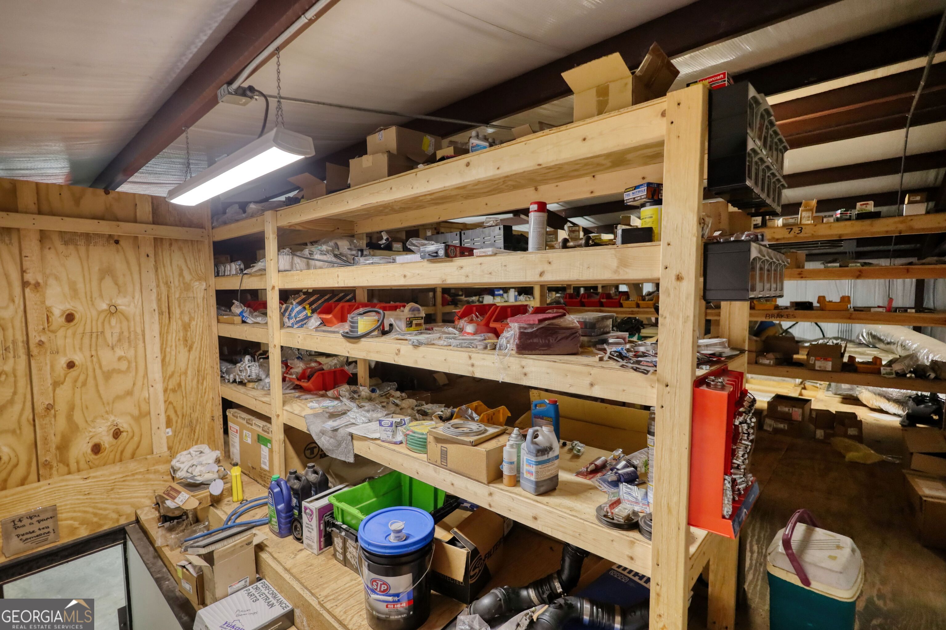 200 Railroad Street Monticello, GA 31064 - Photo 24 of 45 a room with lots of different colored cloths