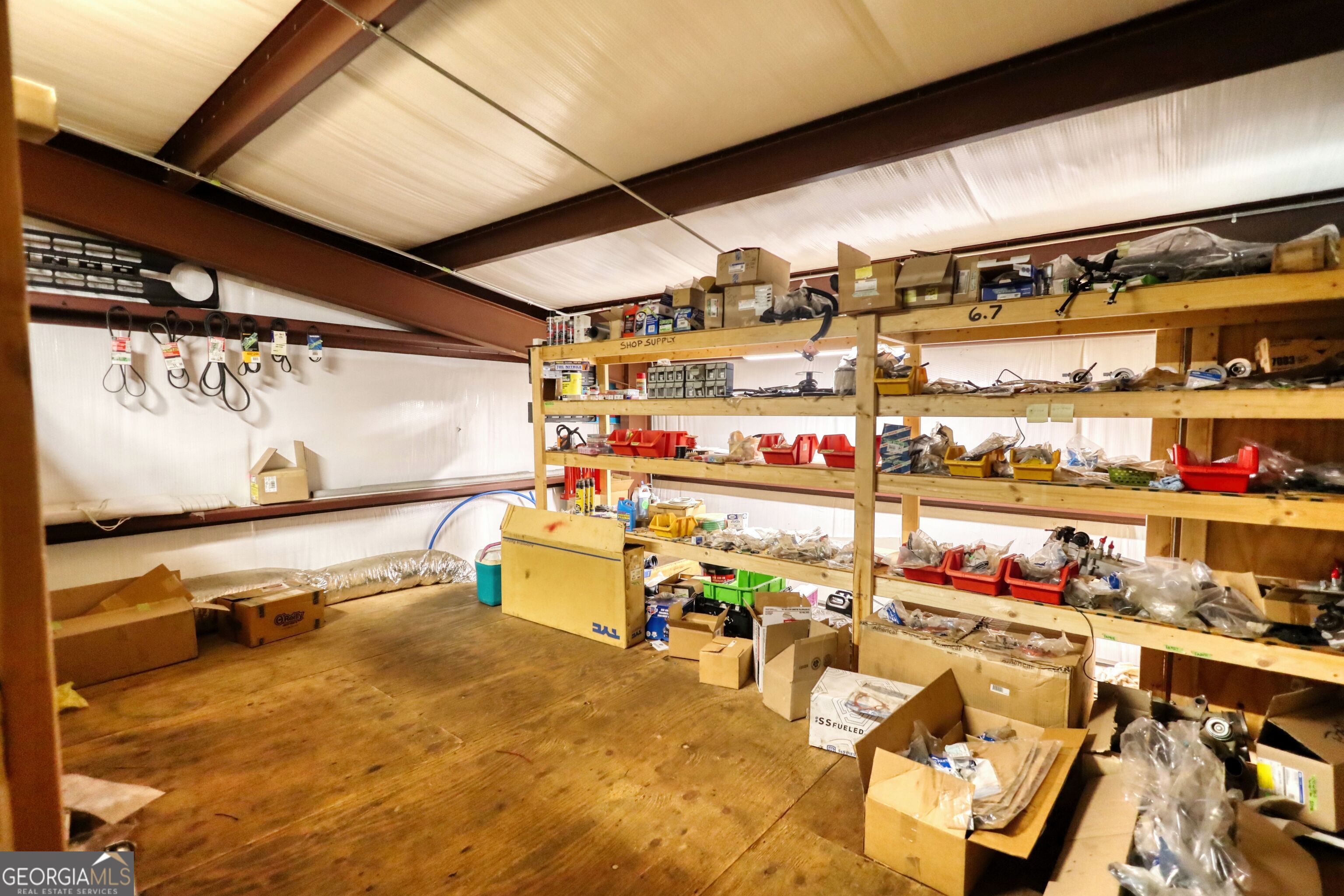 200 Railroad Street Monticello, GA 31064 - Photo 27 of 45 a room with lots of different colored cloths