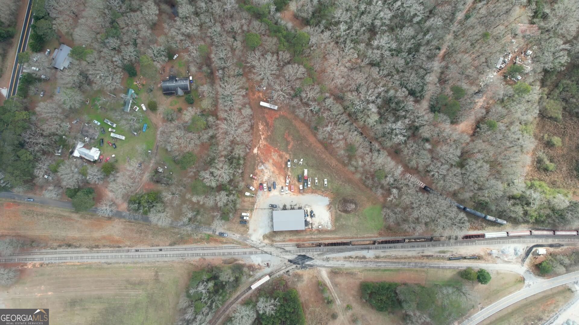200 Railroad Street Monticello, GA 31064 - Photo 33 of 45 a view of a yard with wooden fence