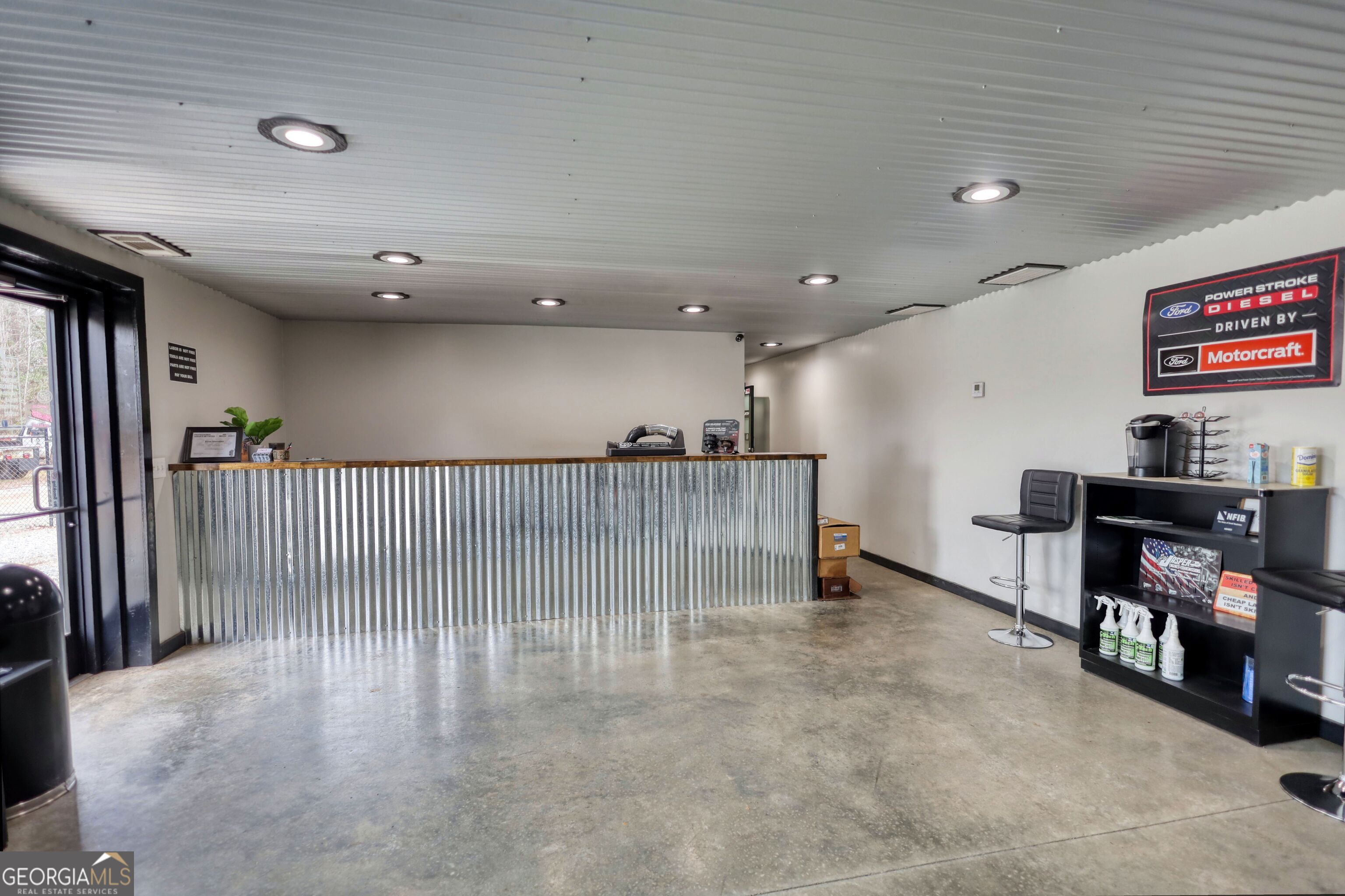 200 Railroad Street Monticello, GA 31064 - Photo 4 of 45 a view of a hallway with workspace