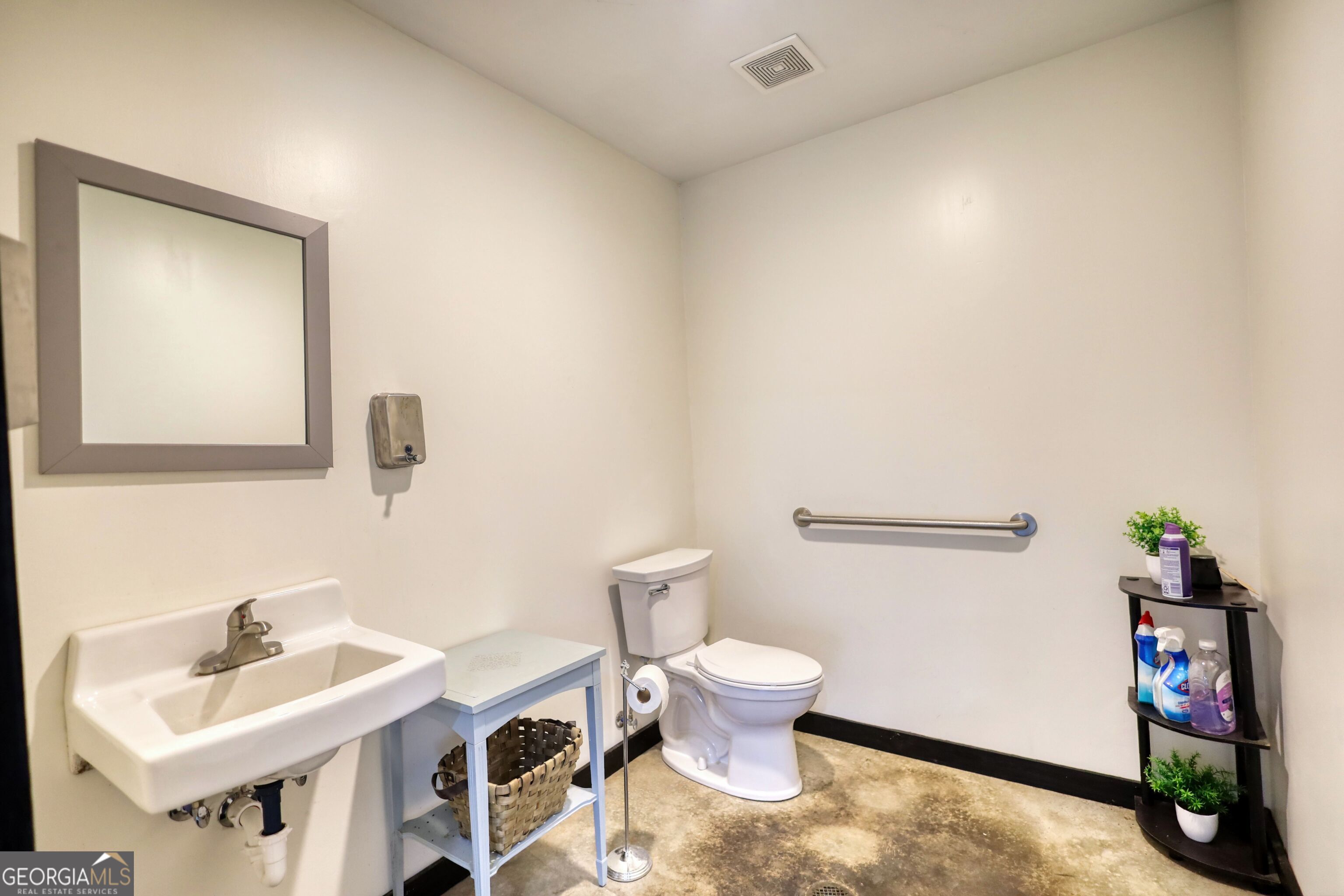 200 Railroad Street Monticello, GA 31064 - Photo 8 of 45 a bathroom with a sink a toilet and a mirror