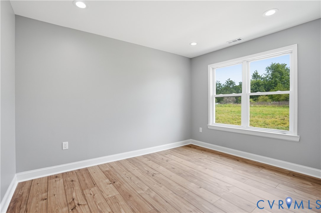 7839 King William Road Aylett, VA 23009 - Photo 27 of 38 an empty room with wooden floor and windows