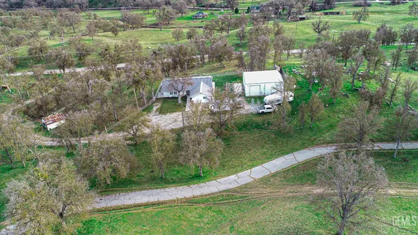 an aerial view of residential house with outdoor space