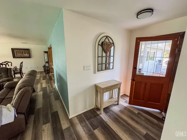 a view of a livingroom with furniture and staircase
