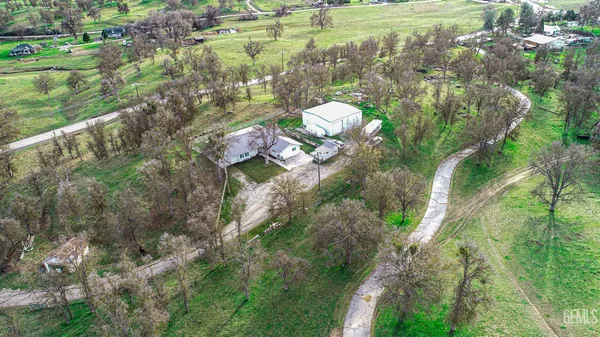 a living room with couches chairs and a flat screen tv