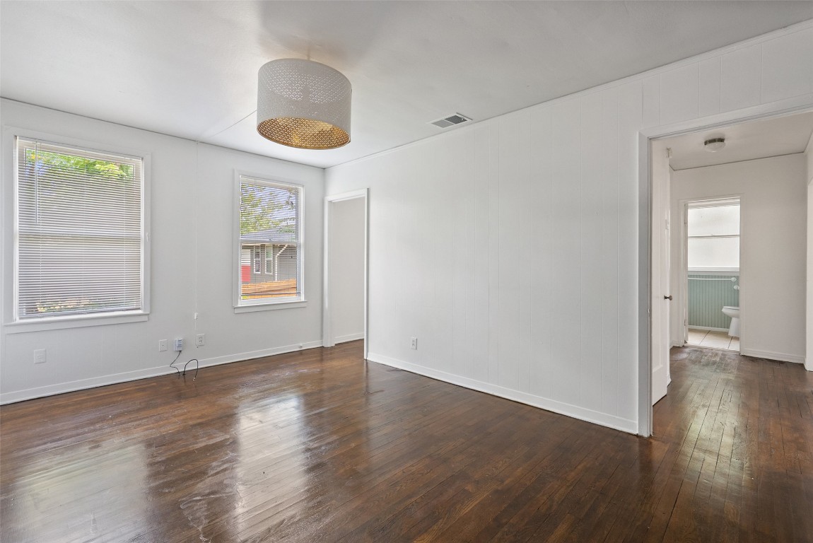 3208 Duval Street Austin, TX 78705 - Photo 11 of 26 a view of an empty room with wooden floor and a window