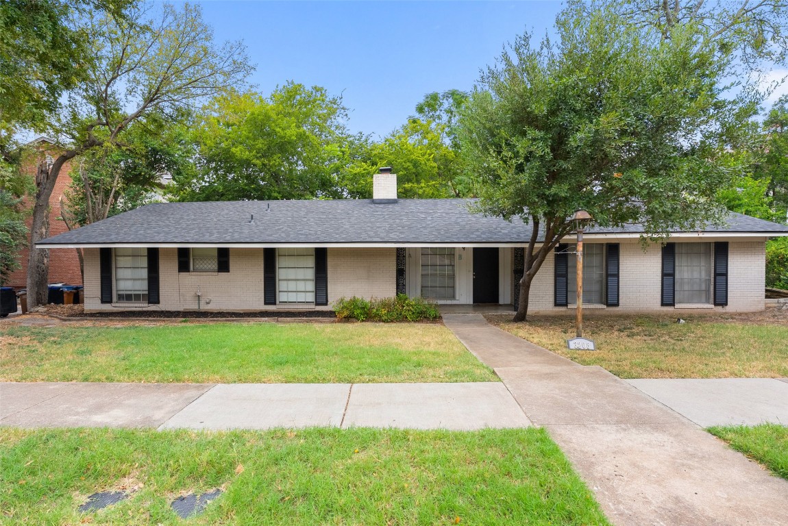 3208 Duval Street Austin, TX 78705 - Photo 2 of 26 a view of a yard in front of a house with large tree