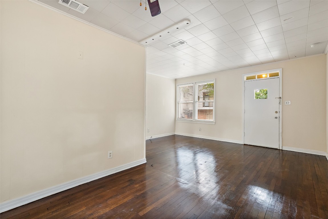3208 Duval Street Austin, TX 78705 - Photo 21 of 26 an empty room with wooden floor and windows