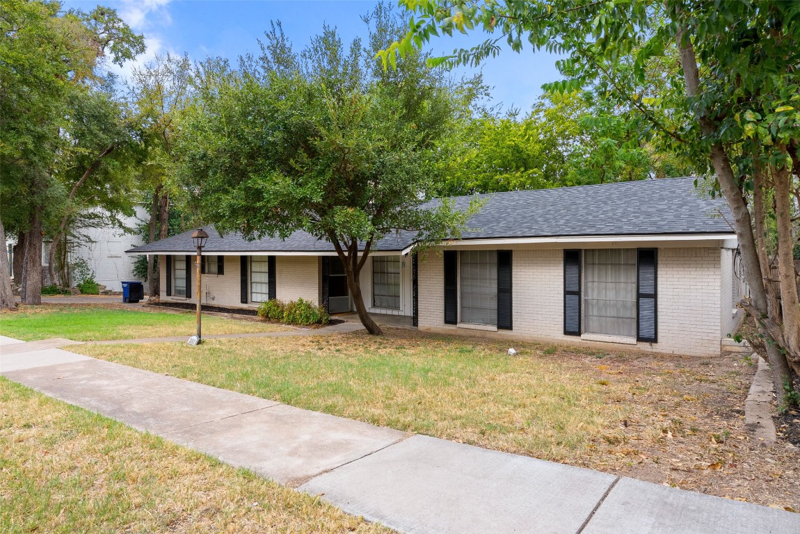 3208 Duval Street Austin, TX 78705 - Photo 3 of 26 a house that has a tree in front of it