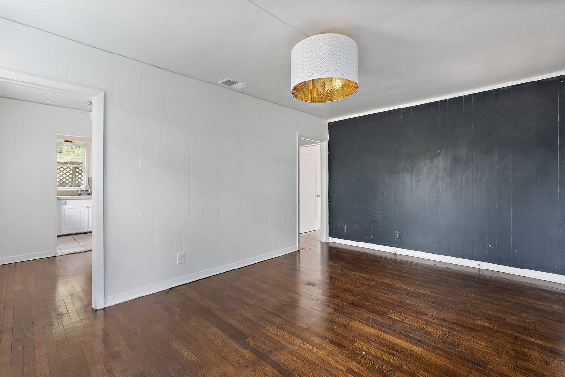 3208 Duval Street Austin, TX 78705 - Photo 10 of 26 a view of an empty room with wooden floor and a window