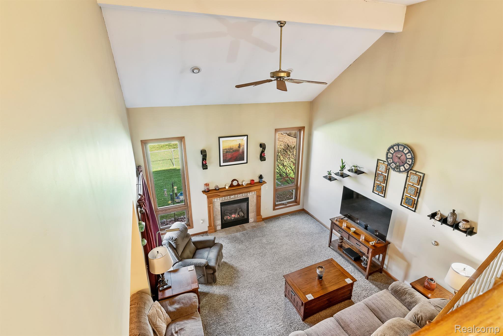 6310 Farrand Road Clio, MI 48420 - Photo 25 of 54 Gas lit fireplace with full windows to enjoy