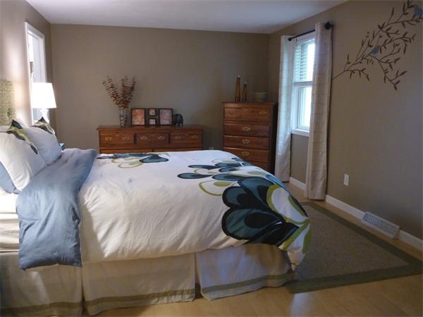 119 Orton Street Extension Worcester, MA 01604 - Photo 15 of 29 a bed sitting in a bedroom next to a window