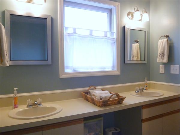 119 Orton Street Extension Worcester, MA 01604 - Photo 18 of 29 a bathroom with a sink and a mirror