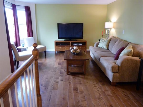 119 Orton Street Extension Worcester, MA 01604 - Photo 4 of 29 a living room with furniture and a flat screen tv