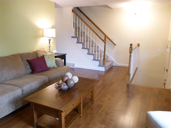 119 Orton Street Extension Worcester, MA 01604 - Photo 5 of 29 a living room with furniture and wooden floor