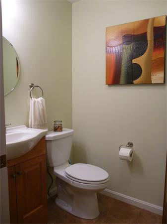 119 Orton Street Extension Worcester, MA 01604 - Photo 6 of 29 a white toilet sitting next to a bathroom sink