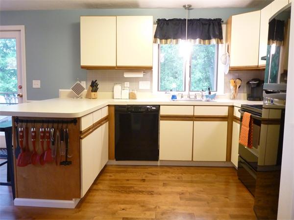 119 Orton Street Extension Worcester, MA 01604 - Photo 10 of 29 a kitchen with stainless steel appliances granite countertop a stove a sink and a microwave