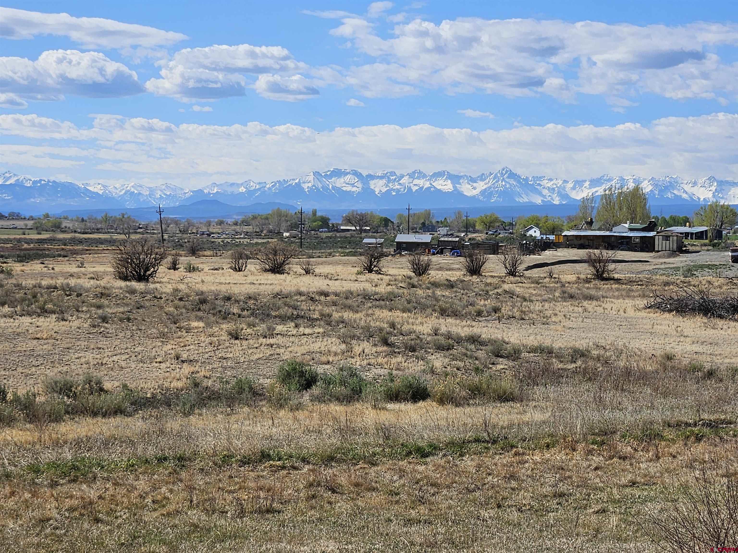 Lot 1 Jade Road Montrose, CO 81401 - Photo 23 of 25 a view of a lake with mountains in the background