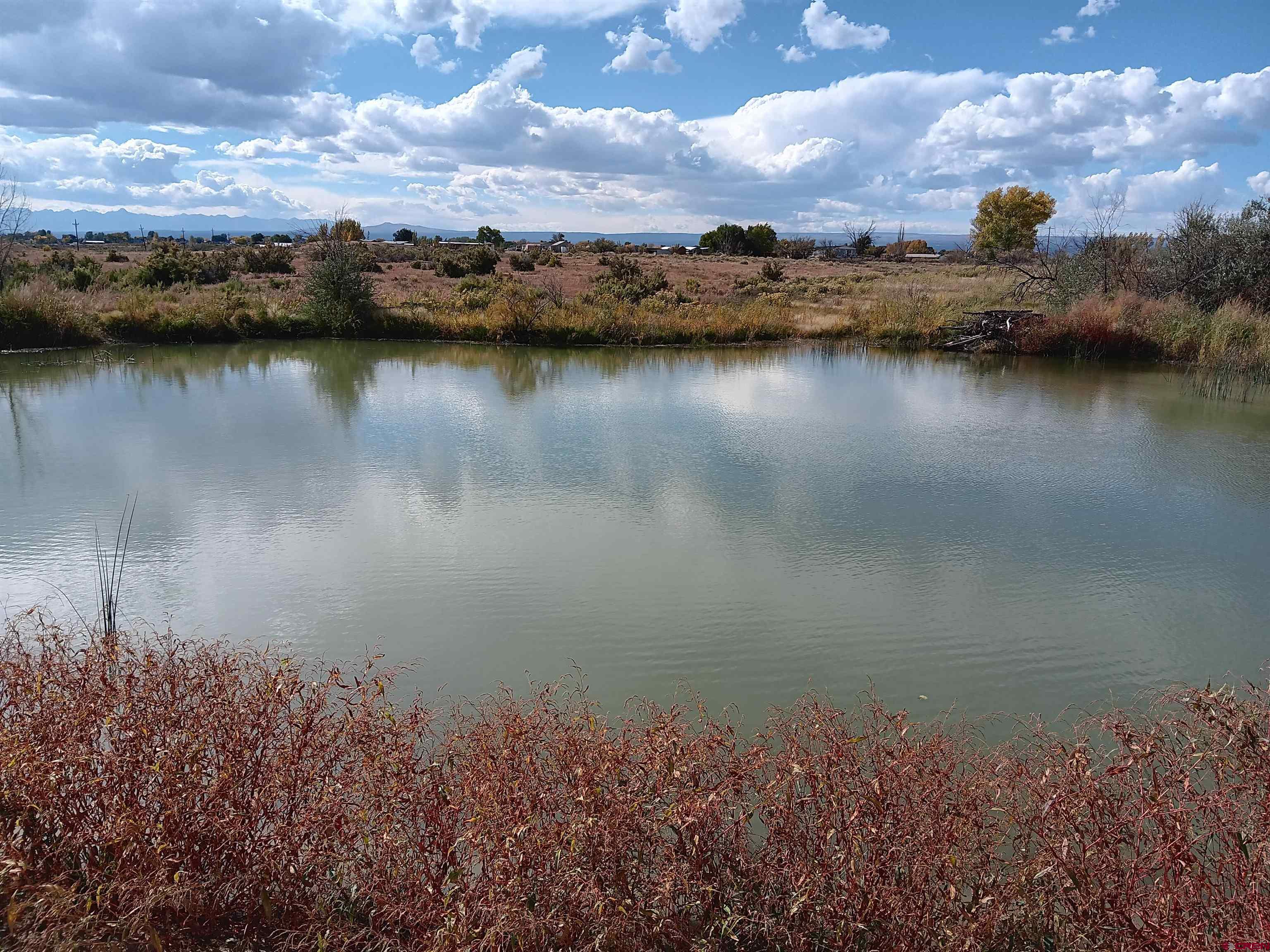 Lot 1 Jade Road Montrose, CO 81401 - Photo 24 of 25 a view of a lake in a city