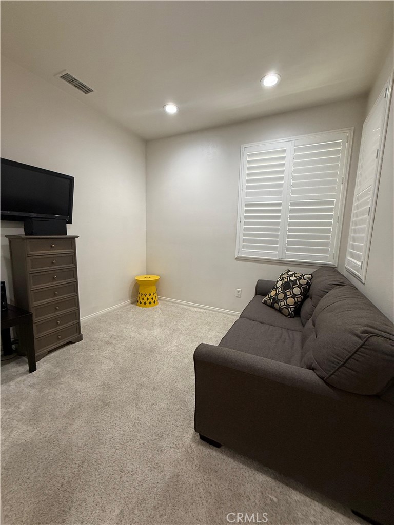 2931 Esperanza Way, Unit B Simi Valley, CA 93063 - Photo 45 of 49 a living room with furniture and a flat screen tv