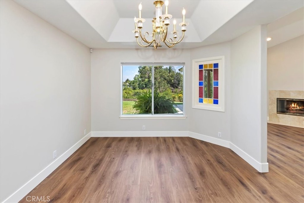 1507 Weston Way Riverside, CA 92506 - Photo 15 of 55 wooden floor in an empty room with a window